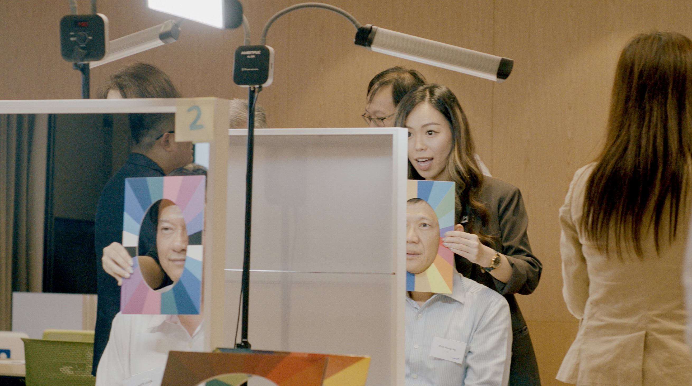 Colour consultant demonstrating personal colour analysis draping technique